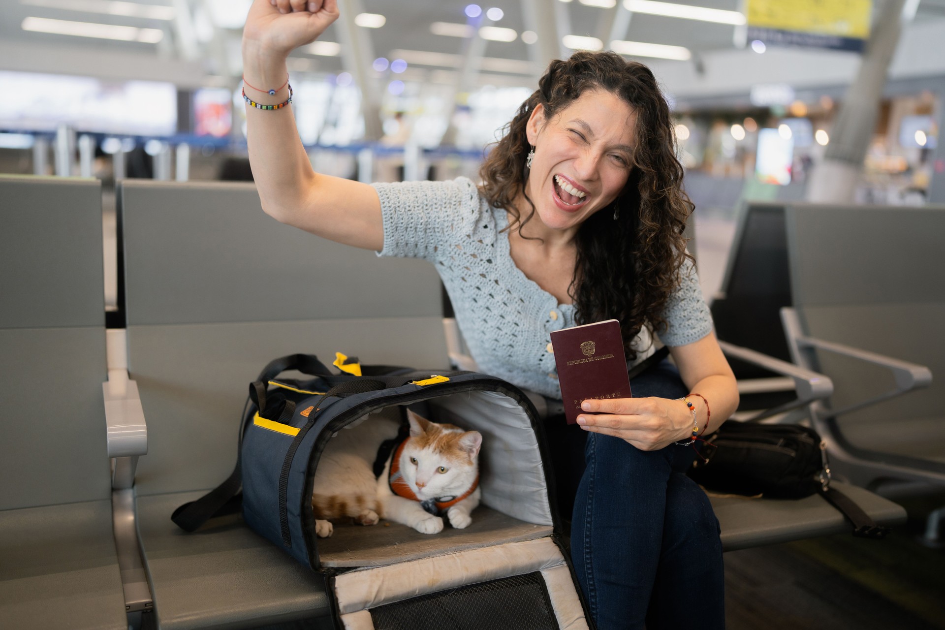 Woman and cat excitedly traveling by air with passport